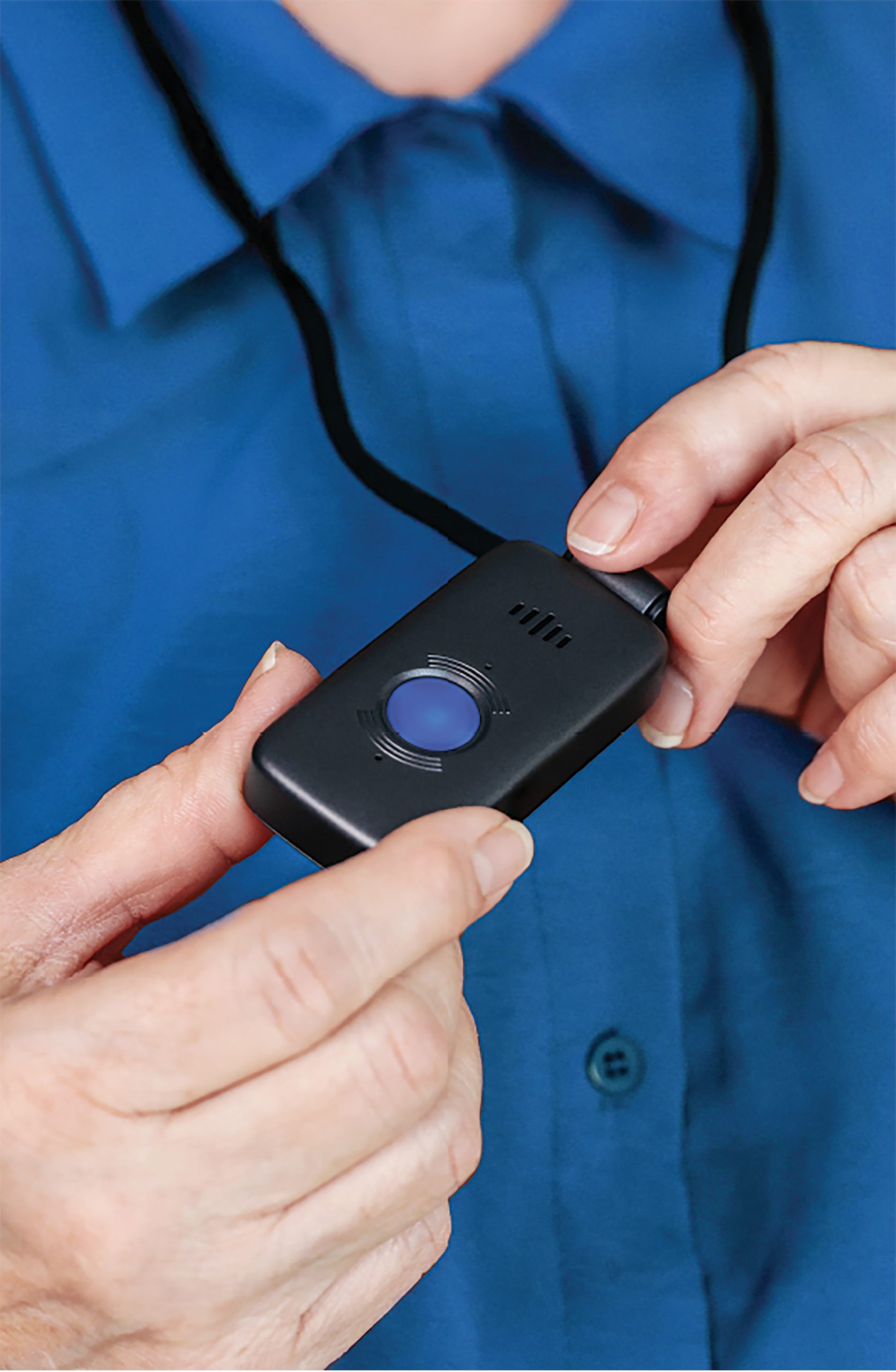 Senior wearing Safety+ Ultra medical alert device